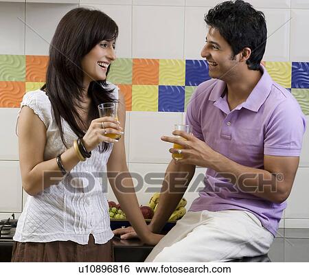 Stock Photograph - Couple enjoying themselves. Fotosearch