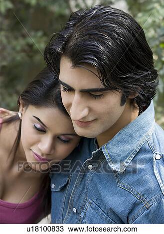 Stock Image - Couple sitting together. Fotosearch