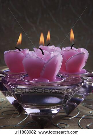 Stock Image - Decorative pink candles. Fotosearch
