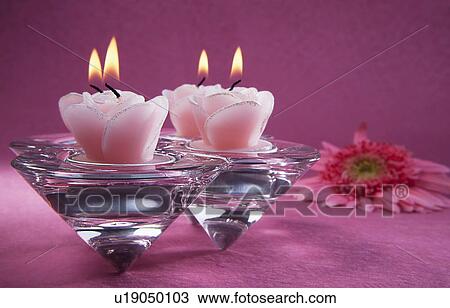 Stock Image - Decorative pink candles. Fotosearch