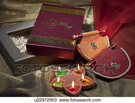 Stock Image - Diwali gifts and diyas. Fotosearch
