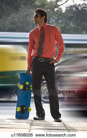 Executive with a skateboard View Large Photo Image Stock Photograph - Executive with a skateboard. Fotosearch