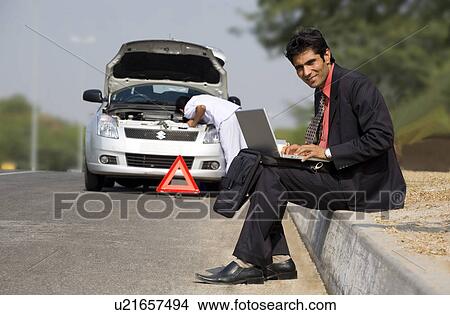 Picture - Executive working on a laptop. Fotosearch