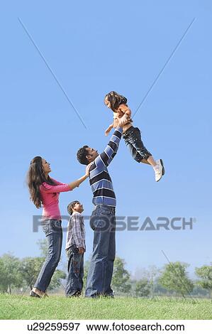Stock Photo - Family having fun. Fotosearch