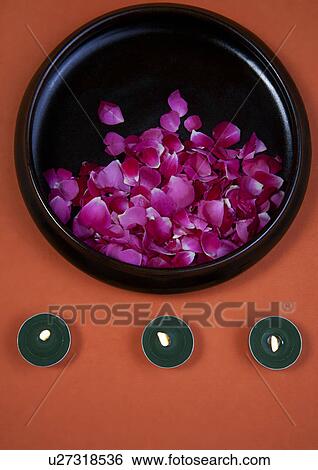 Stock Photograph - Flower petals and candles. Fotosearch
