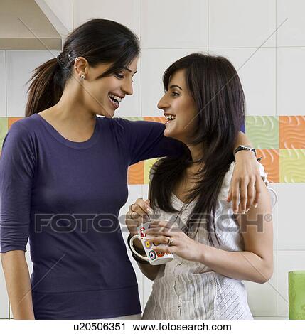 Friends sharing a laugh View Large Photo Image Stock Image - Friends sharing a laugh. Fotosearch