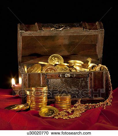 Stock Image - Gold coins in a chest. Fotosearch