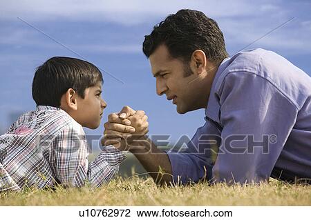 Hand wrestling between son and father View Large Photo Image Stock Image - Hand wrestling between son and father. Fotosearch