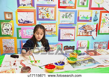 Stock Image - Little girl painting. Fotosearch