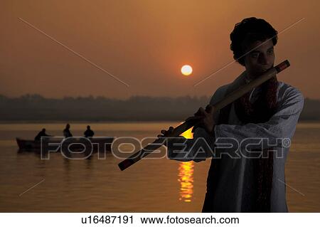 Man playing the flute View Large Photo Image Stock Image - Man playing the flute. Fotosearch