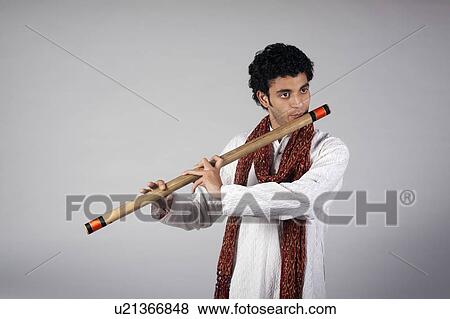 Man playing the flute View Large Photo Image Stock Photo - Man playing the flute. Fotosearch