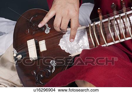 Man playing the sitar View Large Photo Image Picture - Man playing the sitar. Fotosearch