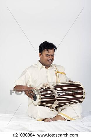 Picture - Man playing the tabla. Fotosearch