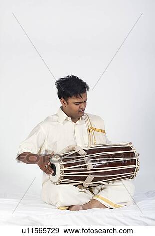 Stock Photo - Man playing the tabla. Fotosearch