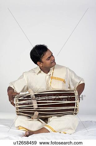 Stock Photo - Man playing the tabla. Fotosearch