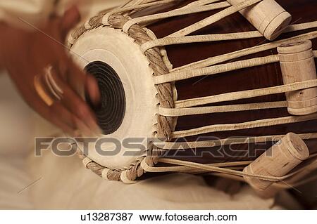Man playing the tabla View Large Photo Image Stock Photo - Man playing the tabla. Fotosearch