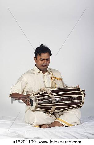 Stock Photo - Man playing the tabla. Fotosearch