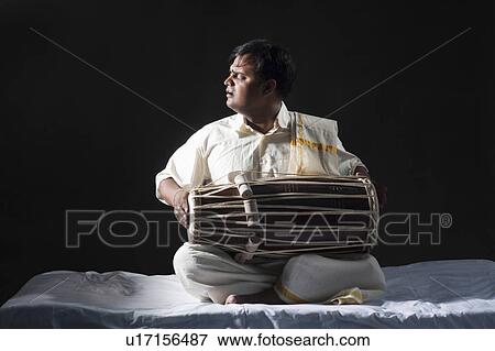 Man playing the tabla View Large Photo Image Stock Photo - Man playing the tabla. Fotosearch