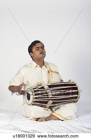 Man playing the tabla View Large Photo Image Stock Photo - Man playing the tabla. Fotosearch
