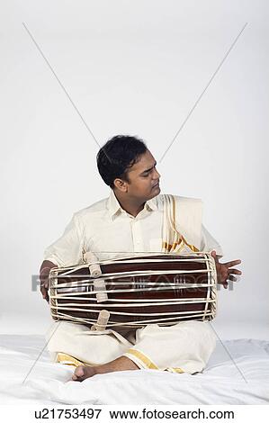 Stock Photo - Man playing the tabla. Fotosearch
