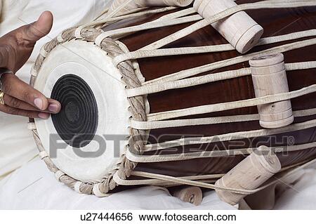 Stock Photograph - Man playing the tabla. Fotosearch