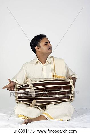 Stock Photography - Man playing the tabla. Fotosearch
