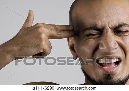 Man pretending to shoot himself View Large Photo Image Stock Image - Man pretending to shoot himself. Fotosearch