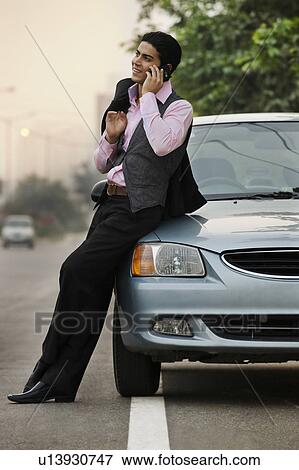 Stock Photo - Man talking on his mobile phone. Fotosearch