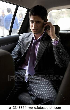 Picture - Man talking on the mobile phone. Fotosearch