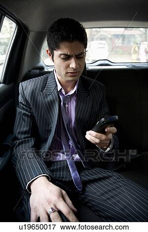 Man with a mobile phone View Large Photo Image Stock Photo - Man with a mobile phone. Fotosearch