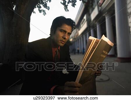 Stock Photo - Man with newspaper . Fotosearch