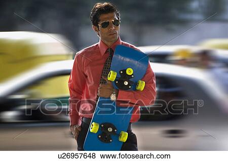 Stock Photo - Man with skateboard . Fotosearch