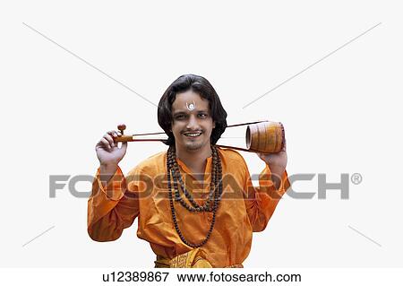 Stock Photo - Minstrel carrying an ektara. Fotosearch