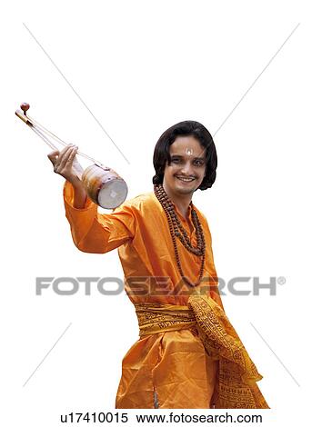 Stock Photography - Minstrel holding an ektara. Fotosearch