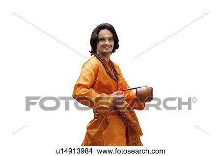 Picture - Minstrel playing with an ektara. Fotosearch
