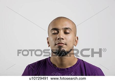 Stock Image - Portrait of a man with eyes closed. Fotosearch