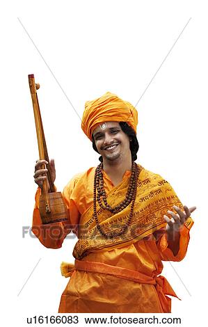 Stock Image - Portrait of a minstrel with an ektara. Fotosearch