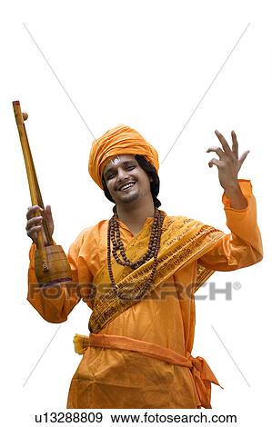 Stock Photo - Portrait of a minstrel with an ektara. Fotosearch