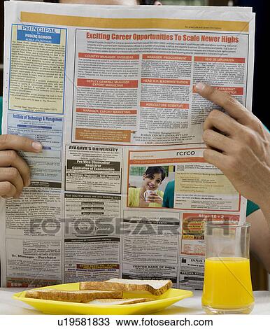 Reading the newspaper View Large Photo Image Stock Image - Reading the newspaper. Fotosearch