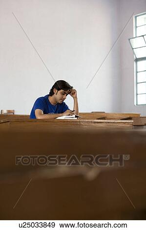 Students reading a book View Large Photo Image Stock Photo - Students reading a book . Fotosearch