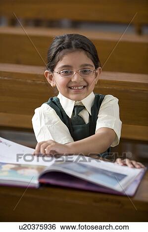 Stock Photograph - Students reading a book . Fotosearch