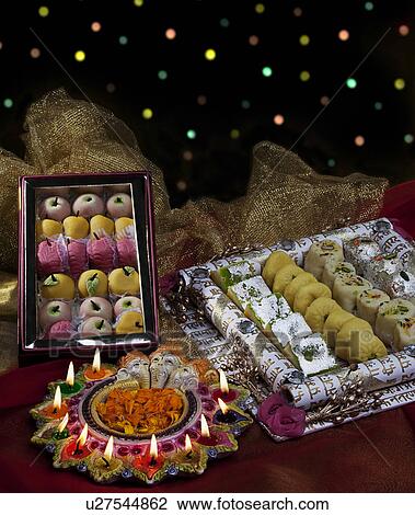 Sweet dishes with diyas View Large Photo Image Stock Image - Sweet dishes with diyas. Fotosearch