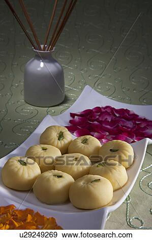 Stock Photo - Sweets and flower petals. Fotosearch