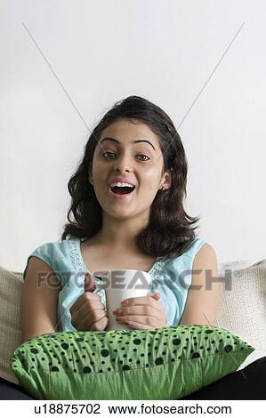 Stock Image - Woman drinking tea. Fotosearch