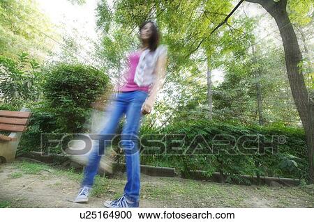 Woman in the park View Large Photo Image Stock Image - Woman in the park. Fotosearch
