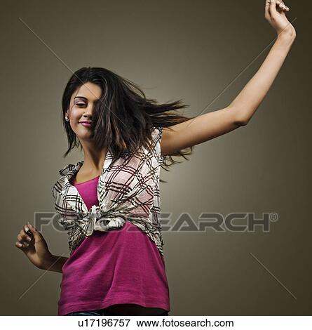 Stock Photo - Young woman enjoying herself. Fotosearch