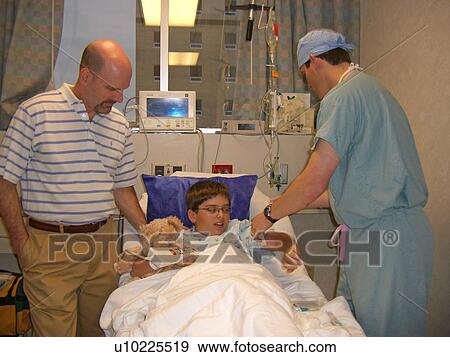 A boy prepares for surgery. View Large Photo Image Stock Photo - A boy prepares for surgery.. Fotosearch