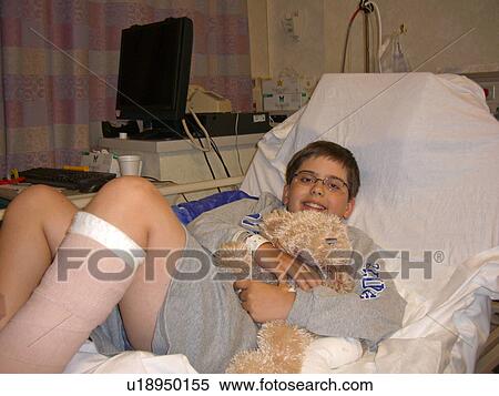 Stock Photography - A boy smiles after a successful surgery.. Fotosearch