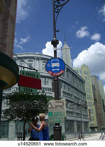 Stock Image - A handicap sign at a bus stop.. Fotosearch