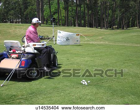 Picture - A man displays how he plays golf.. Fotosearch